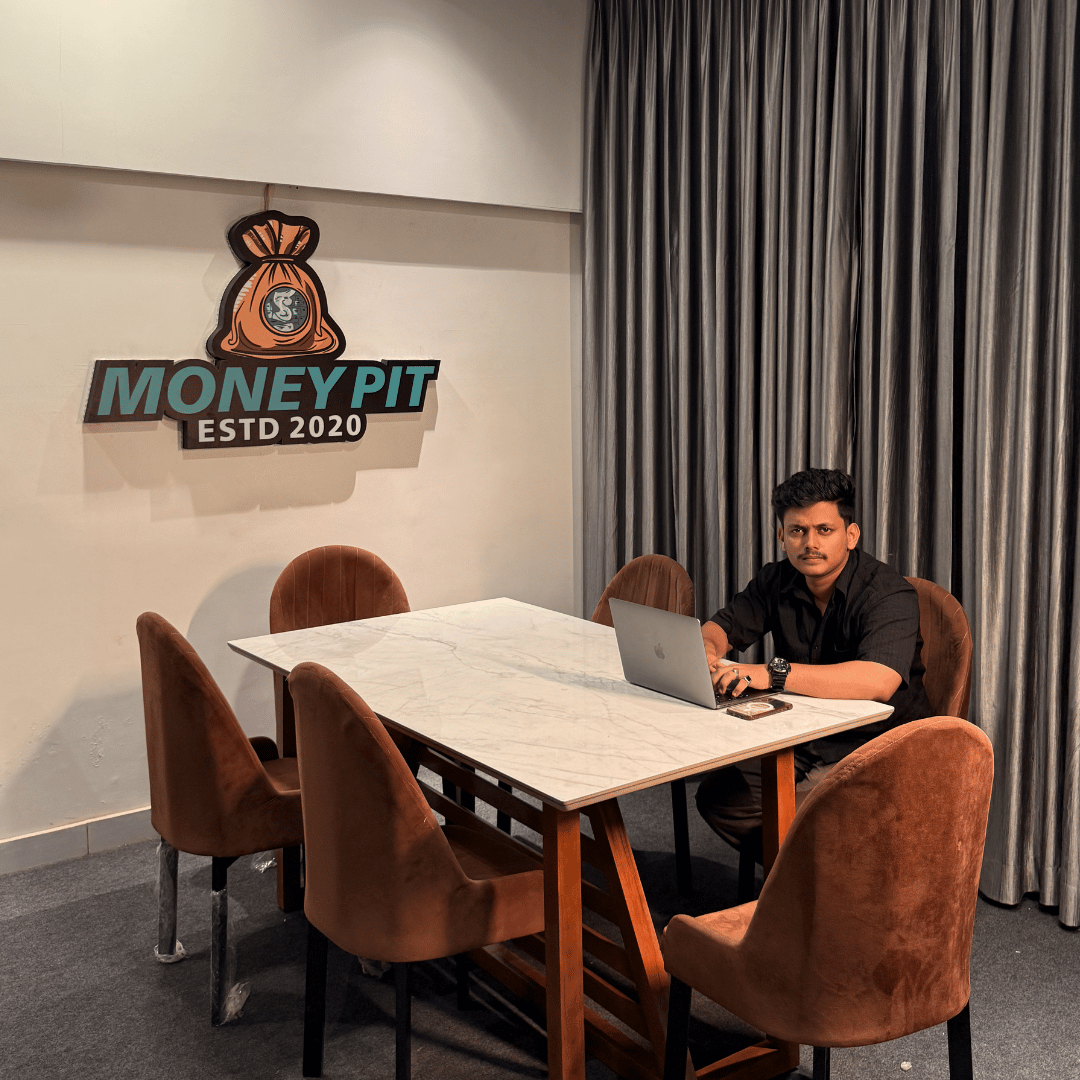 Ahammed Shamhoon sitting at Moneypit Trading Community Office.